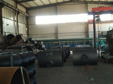 Quality inspectors of Haihao Group do pipe fittings X-ray testing in holiday.