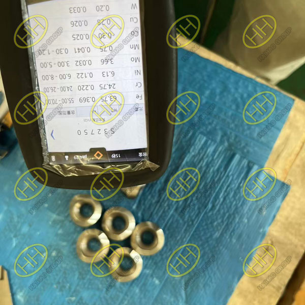 Chemical composition testing of S32750 super duplex welded outlet fittings